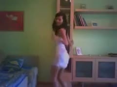 Dancing on a webcam was a svelte black-haired harlot wearing a tight white suit.